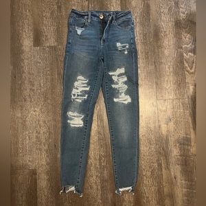 American eagle jeans. Very stretchy. Size 4. Holes are patched.
